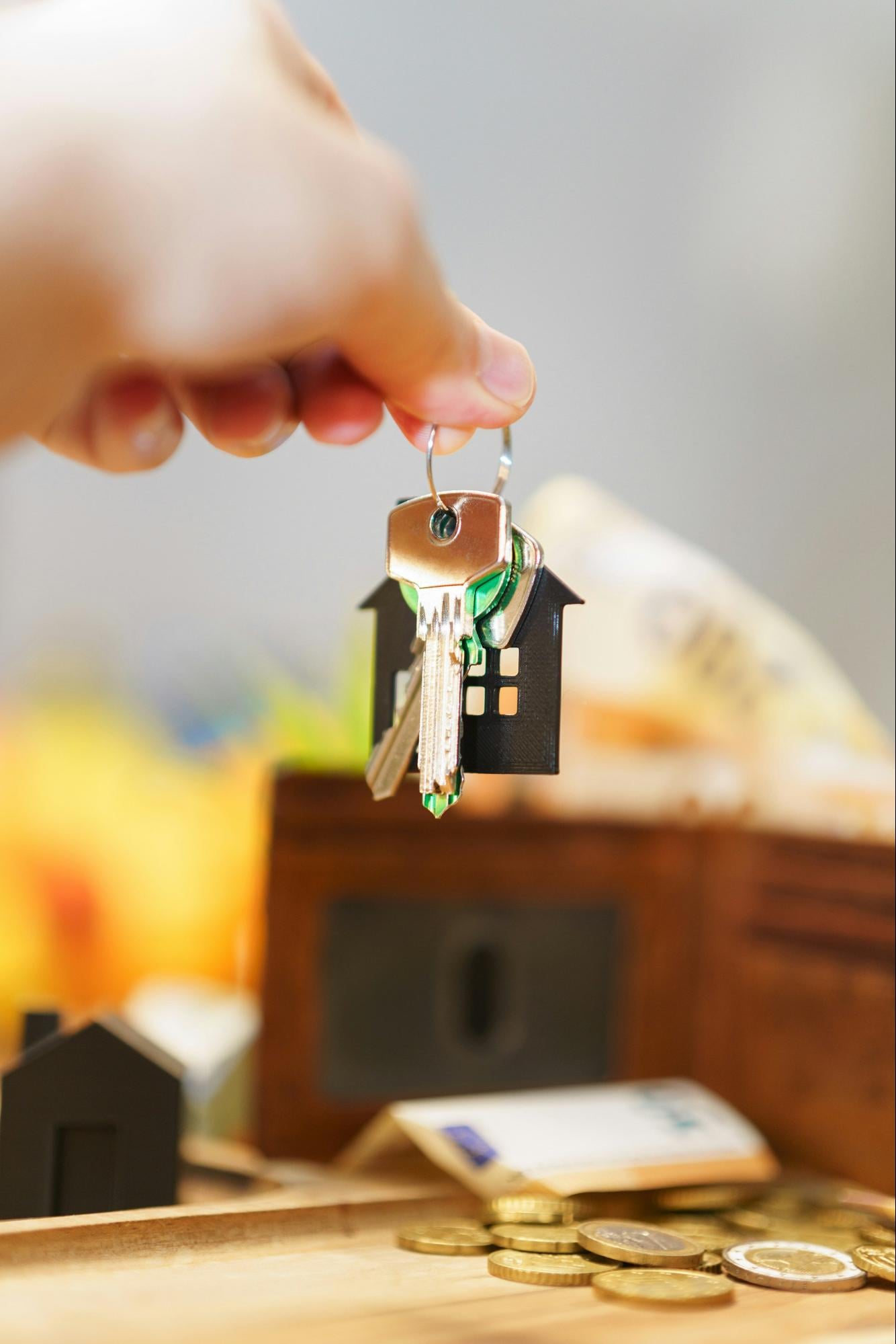 Homebuyer holding house keys symbolizing common property issues buyers often discover during home inspections.
