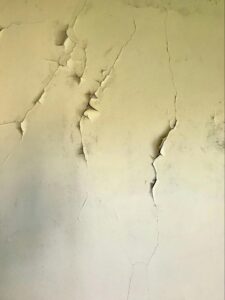 Cracked interior wall surface showing structural damage commonly identified during a home inspection.